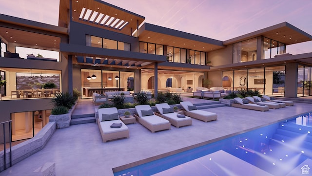 1272 N Hillside Way, Santa Clara, UT 84765 - back house at dusk with an outdoor hangout area and a patio area