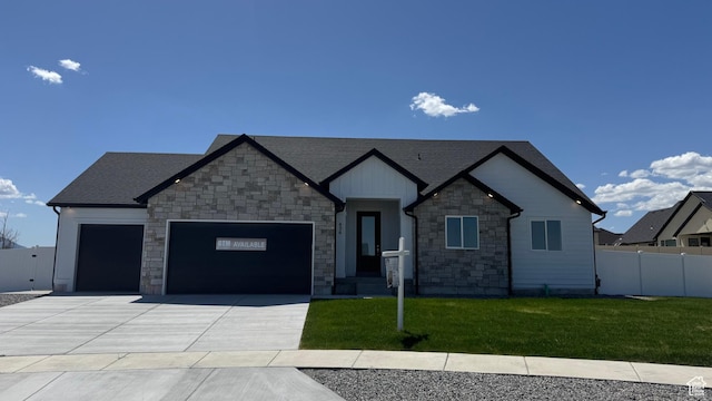 426 E Redwood Ln Unit 119, Grantsville, UT 84029 - craftsman inspired home with an attached garage, stone siding, driveway, and roof with shingles