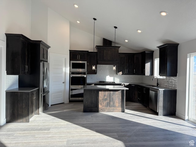 426 E Redwood Ln Unit 119, Grantsville, UT 84029 - kitchen featuring stainless steel appliances, a sink, a kitchen island, light wood finished floors, and recessed lighting