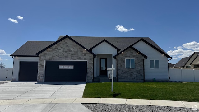 426 E Redwood Ln Unit 119, Grantsville, UT 84029 - craftsman inspired home featuring stone siding, a garage, concrete driveway, and a shingled roof