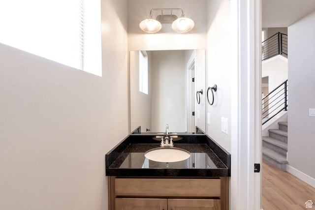 9829 N Aaron Ave Unit 213, Eagle Mountain, UT 84005 - bathroom with vanity and hardwood / wood-style floors