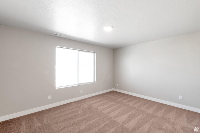 9829 N Aaron Ave Unit 213, Eagle Mountain, UT 84005 - spare room with carpet floors and a textured ceiling