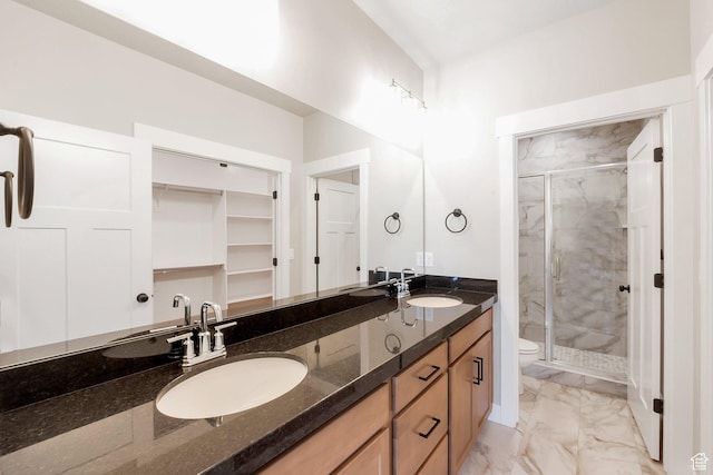 9829 N Aaron Ave Unit 213, Eagle Mountain, UT 84005 - bathroom featuring vanity, toilet, and an enclosed shower