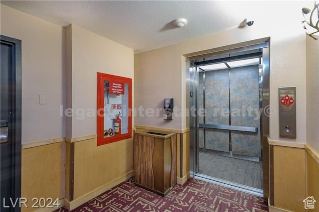 223 Hunter Ridge Rd Unit B303, Brian Head, UT 84719 - interior space with a textured ceiling and elevator