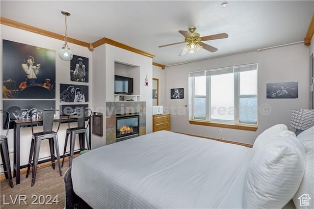 223 Hunter Ridge Rd Unit B303, Brian Head, UT 84719 - bedroom featuring ceiling fan, ornamental molding, and a tile fireplace