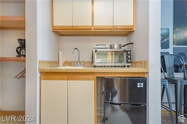 223 Hunter Ridge Rd Unit B303, Brian Head, UT 84719 - kitchen featuring stainless steel refrigerator, sink, and white cabinets