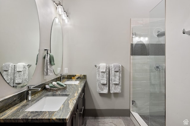 1310 Mellow Rd, Park City, UT 84060 - full bathroom featuring double vanity, a sink, and a stall shower