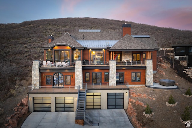 1310 Mellow Rd, Park City, UT 84060 - exterior space with a chimney, an attached garage, driveway, and a balcony