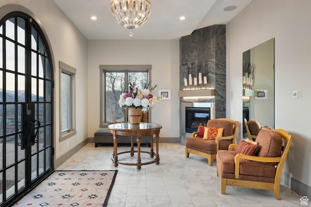 1310 Mellow Rd, Park City, UT 84060 - living room featuring marble finish floor, a notable chandelier, a large fireplace, and recessed lighting
