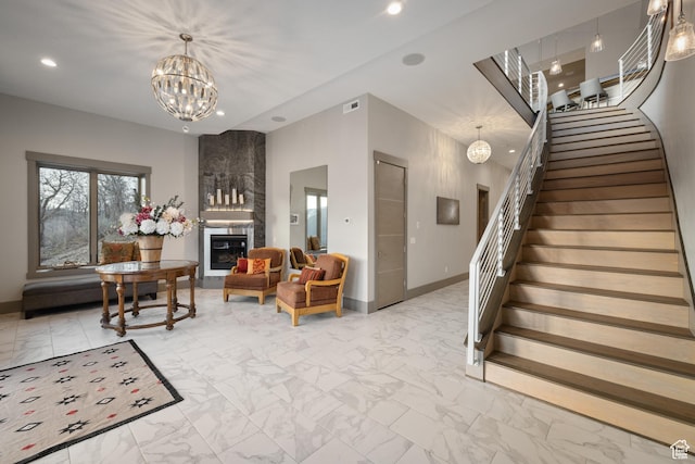 1310 Mellow Rd, Park City, UT 84060 - living room with recessed lighting, marble finish floor, an inviting chandelier, and stairs