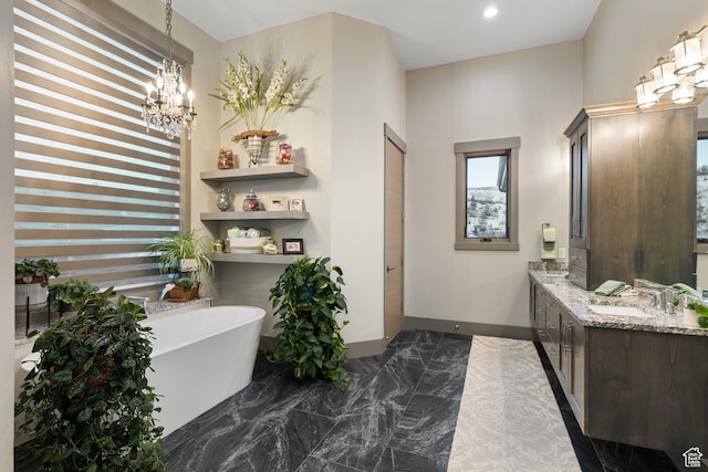 1310 Mellow Rd, Park City, UT 84060 - full bath with vanity, a chandelier, recessed lighting, a freestanding bath, and marble finish floor