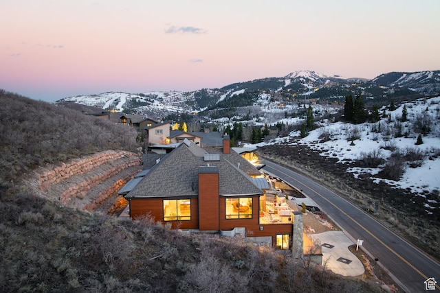 1310 Mellow Rd, Park City, UT 84060 - snow covered rear of property with a mountain view and a chimney