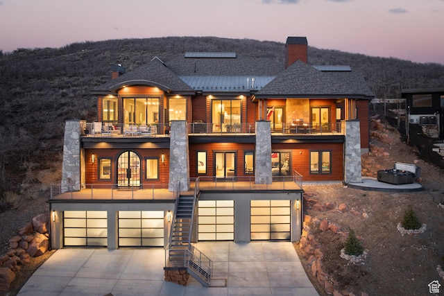 1310 Mellow Rd, Park City, UT 84060 - exterior space featuring an attached garage, stairs, driveway, and a balcony