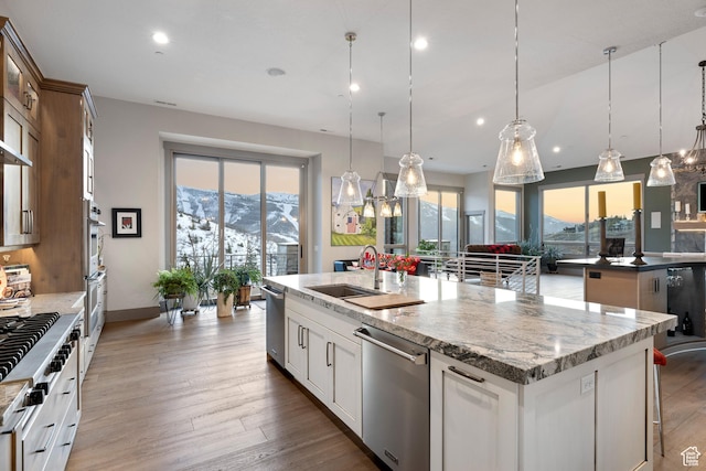 1310 Mellow Rd, Park City, UT 84060 - kitchen with a mountain view, a sink, a kitchen island with sink, pendant lighting, and stainless steel dishwasher
