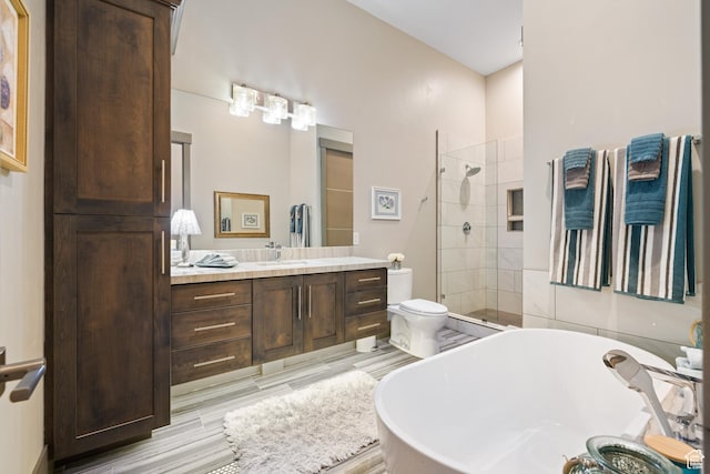 1310 Mellow Rd, Park City, UT 84060 - bathroom featuring a freestanding tub, vanity, a tile shower, and wood finished floors