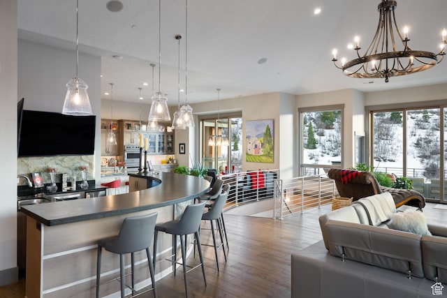 1310 Mellow Rd, Park City, UT 84060 - interior space featuring recessed lighting, a sink, dark countertops, open floor plan, and a notable chandelier