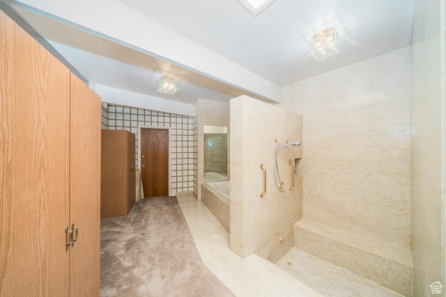 975 N 1600 E, Logan, UT 84321 - bathroom featuring walk in shower, tile walls, and a garden tub