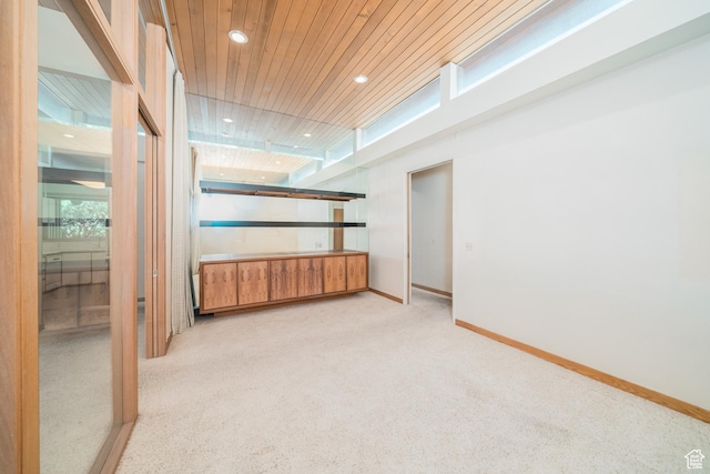 975 N 1600 E, Logan, UT 84321 - empty room featuring wooden ceiling, baseboards, light colored carpet, recessed lighting, and a healthy amount of sunlight