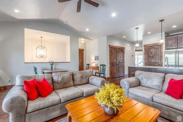14160 N Council Fire Trl, Heber City, UT 84032 - living area featuring wood finished floors, ceiling fan, lofted ceiling, recessed lighting, and a chandelier