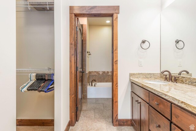 14160 N Council Fire Trl, Heber City, UT 84032 - bathroom with vanity, a walk in closet, and a bath