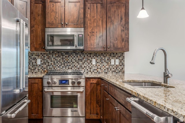 14160 N Council Fire Trl, Heber City, UT 84032 - kitchen featuring high quality appliances, a sink, light stone countertops, backsplash, and dark brown cabinetry