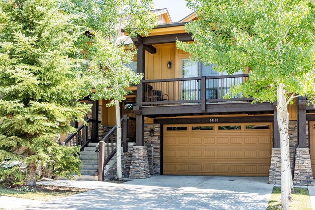 14160 N Council Fire Trl, Heber City, UT 84032 - view of front of home featuring an attached garage, stone siding, driveway, and stairway