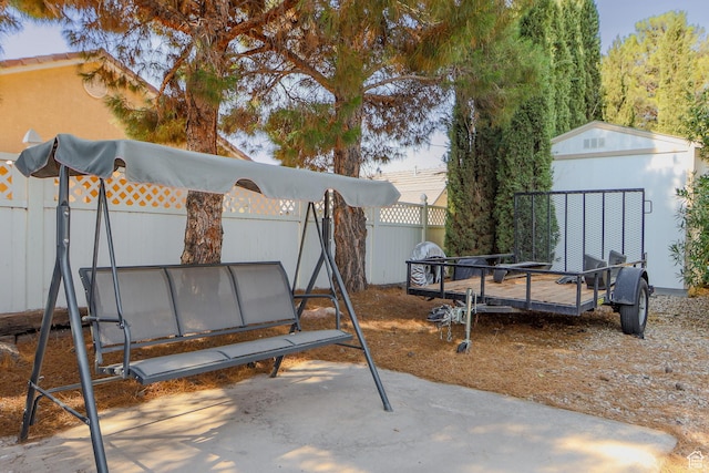 view of patio with a storage shed