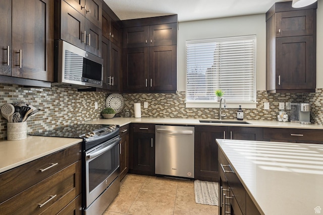 635 W 0470 N, Moab, UT 84532 - kitchen featuring tasteful backsplash, light tile patterned floors, appliances with stainless steel finishes, and sink