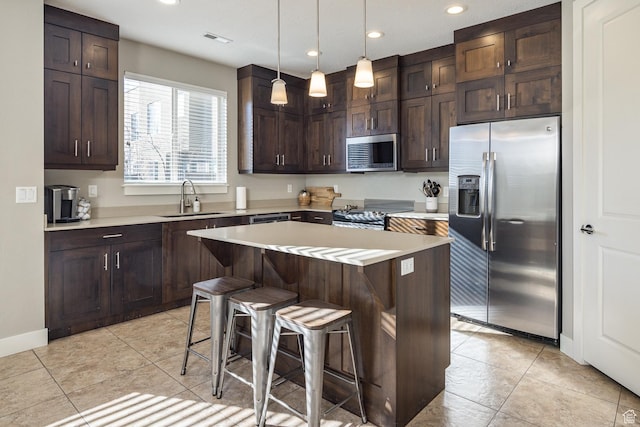 631 W 470 N, Moab, UT 84532 - kitchen with decorative light fixtures, a center island, sink, appliances with stainless steel finishes, and a breakfast bar area
