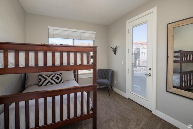 631 W 470 N, Moab, UT 84532 - carpeted bedroom with access to exterior and multiple windows