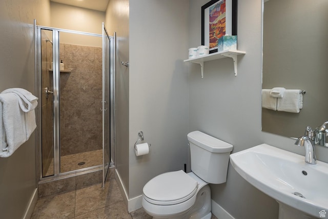 631 W 470 N, Moab, UT 84532 - bathroom featuring toilet, a shower with shower door, and sink