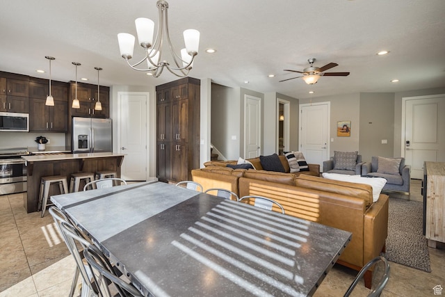 631 W 470 N, Moab, UT 84532 - tiled dining room featuring ceiling fan with notable chandelier