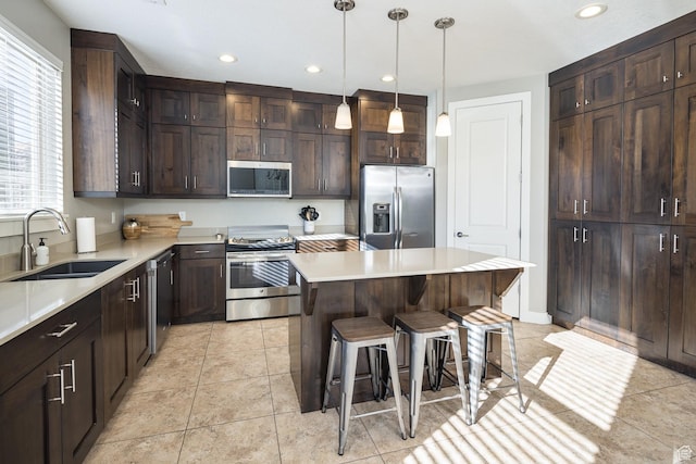 631 W 470 N, Moab, UT 84532 - kitchen with dark brown cabinetry, sink, stainless steel appliances, and a kitchen island