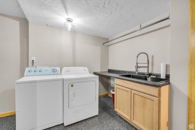 751 W 4350 S, Riverdale, UT 84405 - washroom with a textured ceiling, separate washer and dryer, a sink, baseboards, and cabinet space