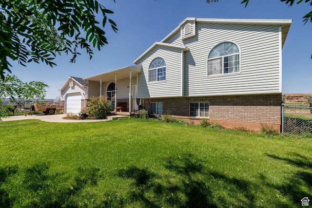 view of front of house featuring a garage and a front yard