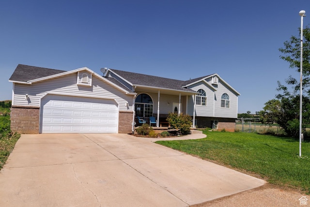2546 W 1200 N, Roosevelt, UT 84066 - view of front of house with a porch, a garage, and a front yard