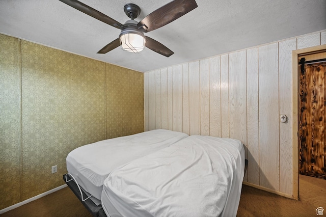 bedroom with baseboards and ceiling fan