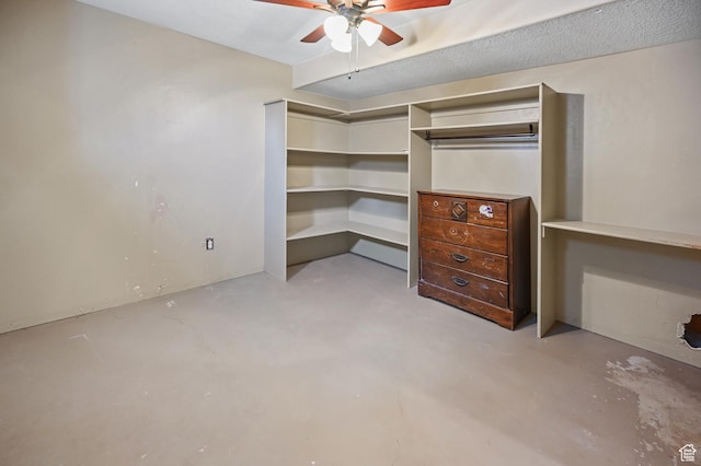 interior space with concrete floors and ceiling fan