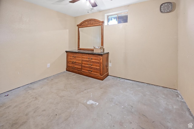bedroom with concrete flooring and ceiling fan