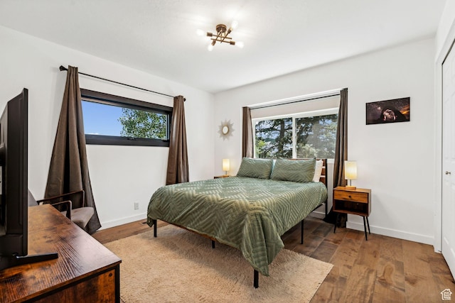 6387 Silver Sage Dr, Park City, UT 84098 - bedroom featuring hardwood / wood-style flooring and multiple windows