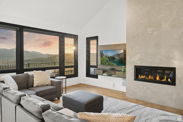 6387 Silver Sage Dr, Park City, UT 84098 - living room with light hardwood / wood-style floors, high vaulted ceiling, and a wealth of natural light