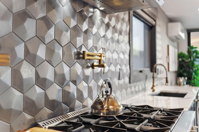 6387 Silver Sage Dr, Park City, UT 84098 - kitchen with a wall mounted air conditioner, sink, and decorative backsplash