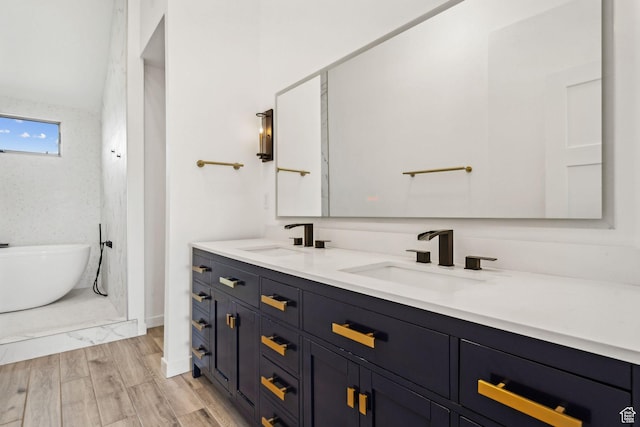 6387 Silver Sage Dr, Park City, UT 84098 - bathroom with wood-type flooring, a washtub, and vanity