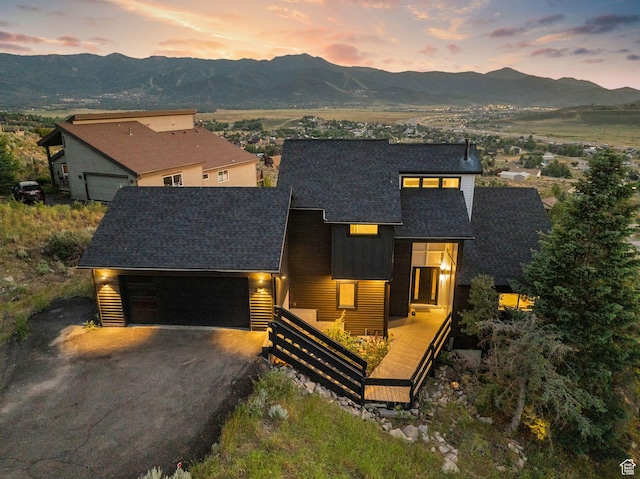 6387 Silver Sage Dr, Park City, UT 84098 - view of front of house with a garage and a mountain view