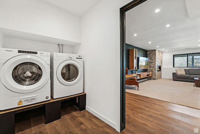 6387 Silver Sage Dr, Park City, UT 84098 - clothes washing area featuring separate washer and dryer, a fireplace, and wood-type flooring