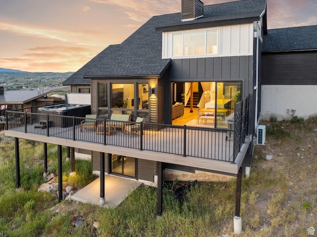 6387 Silver Sage Dr, Park City, UT 84098 - back house at dusk featuring a patio
