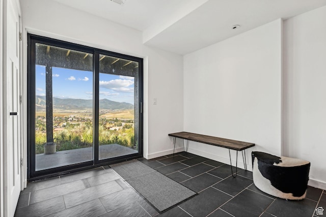 6387 Silver Sage Dr, Park City, UT 84098 - doorway to outside featuring dark tile patterned floors and a mountain view