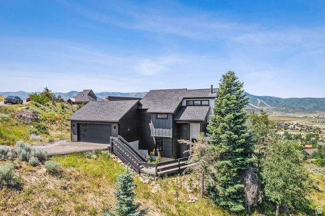 6387 Silver Sage Dr, Park City, UT 84098 - view of front of house featuring a garage and a mountain view