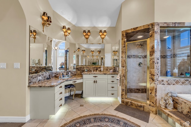 327 N 1430 E, Logan, UT 84321 - bathroom featuring vanity, tile patterned flooring, and shower with separate bathtub