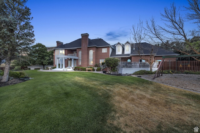 327 N 1430 E, Logan, UT 84321 - rear view of property featuring a patio and a lawn